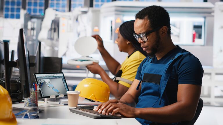 african american industrial technician assesses system health in solar facility